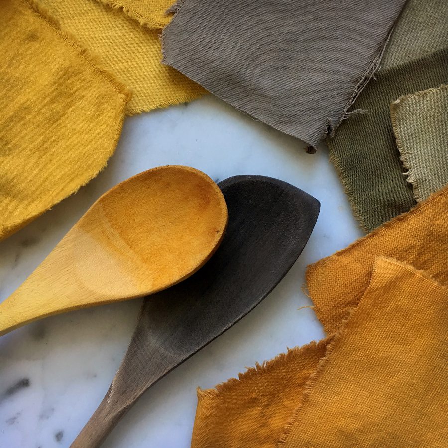 Wooden spoons dyed yellow and deep brown from use