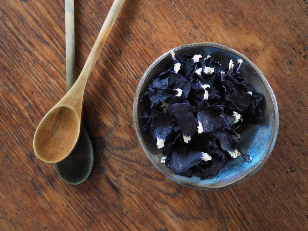 Black Hollyhock natural plant dye in a bowl