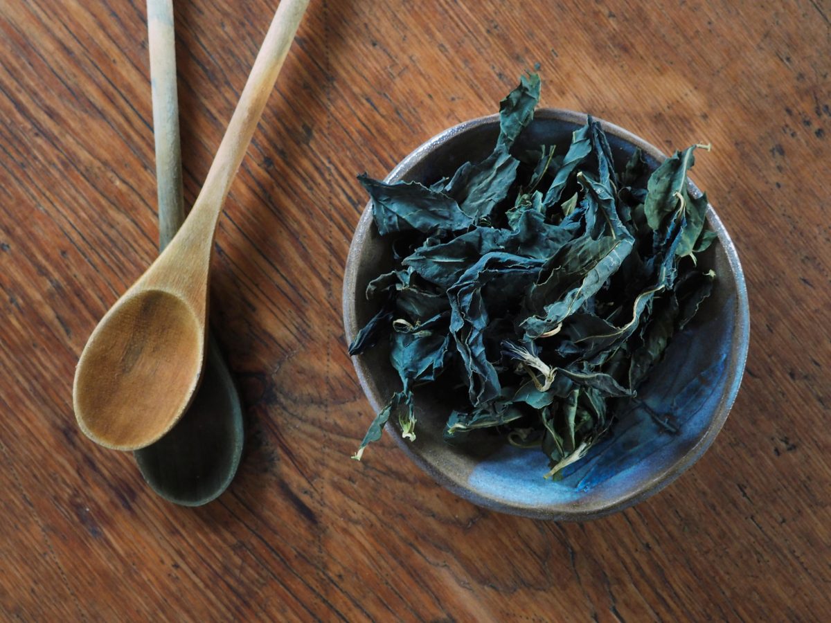 Dried indigo leaves in a bowl