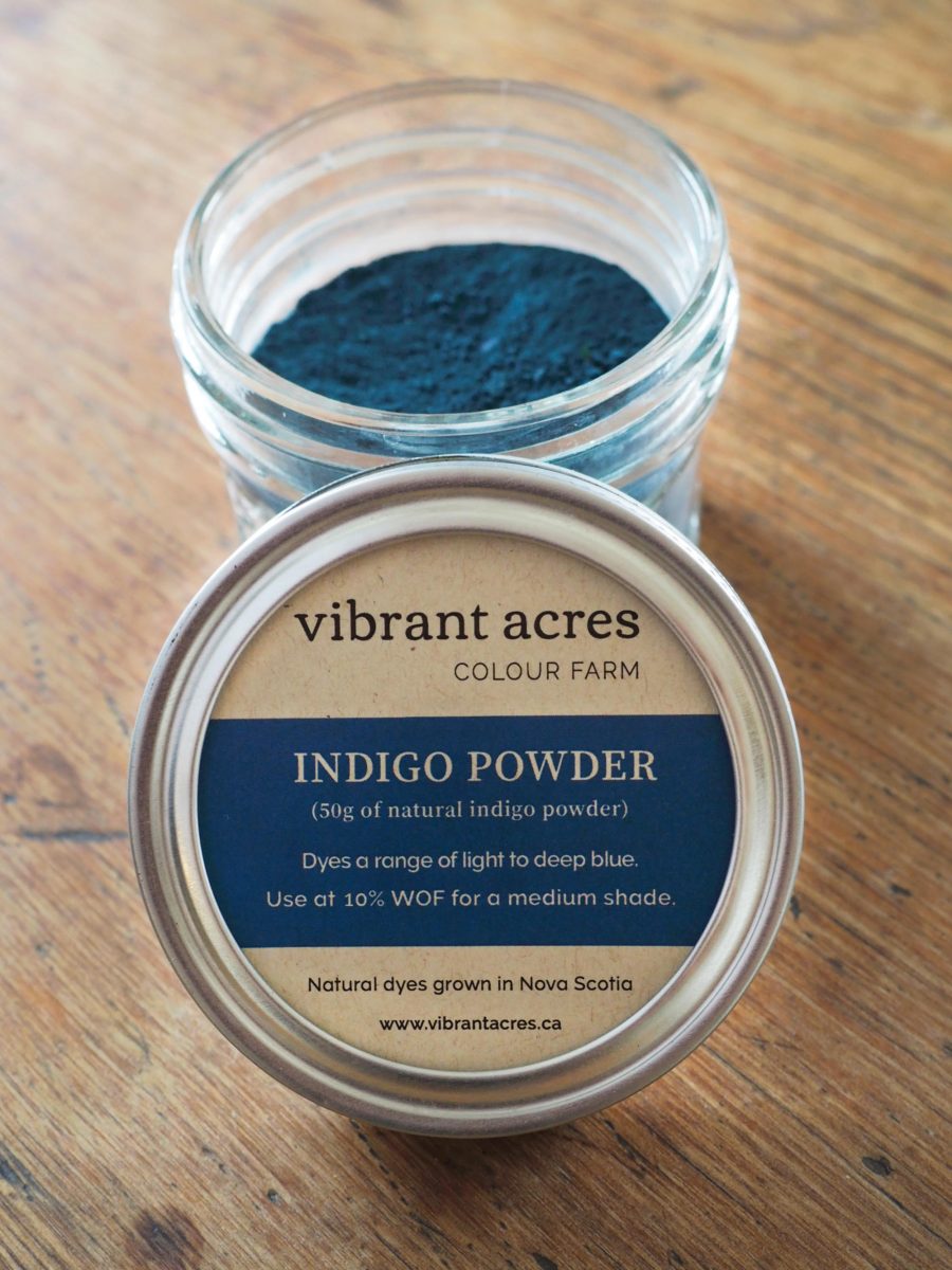 Jar of indigo powder with Vibrant Acres label